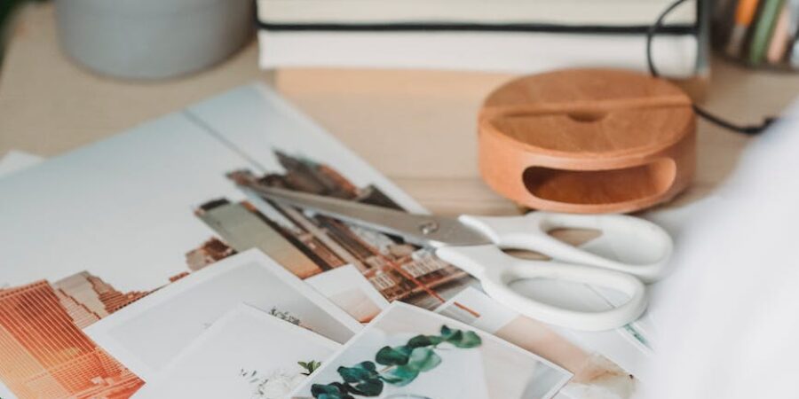 table with various photos and scissors